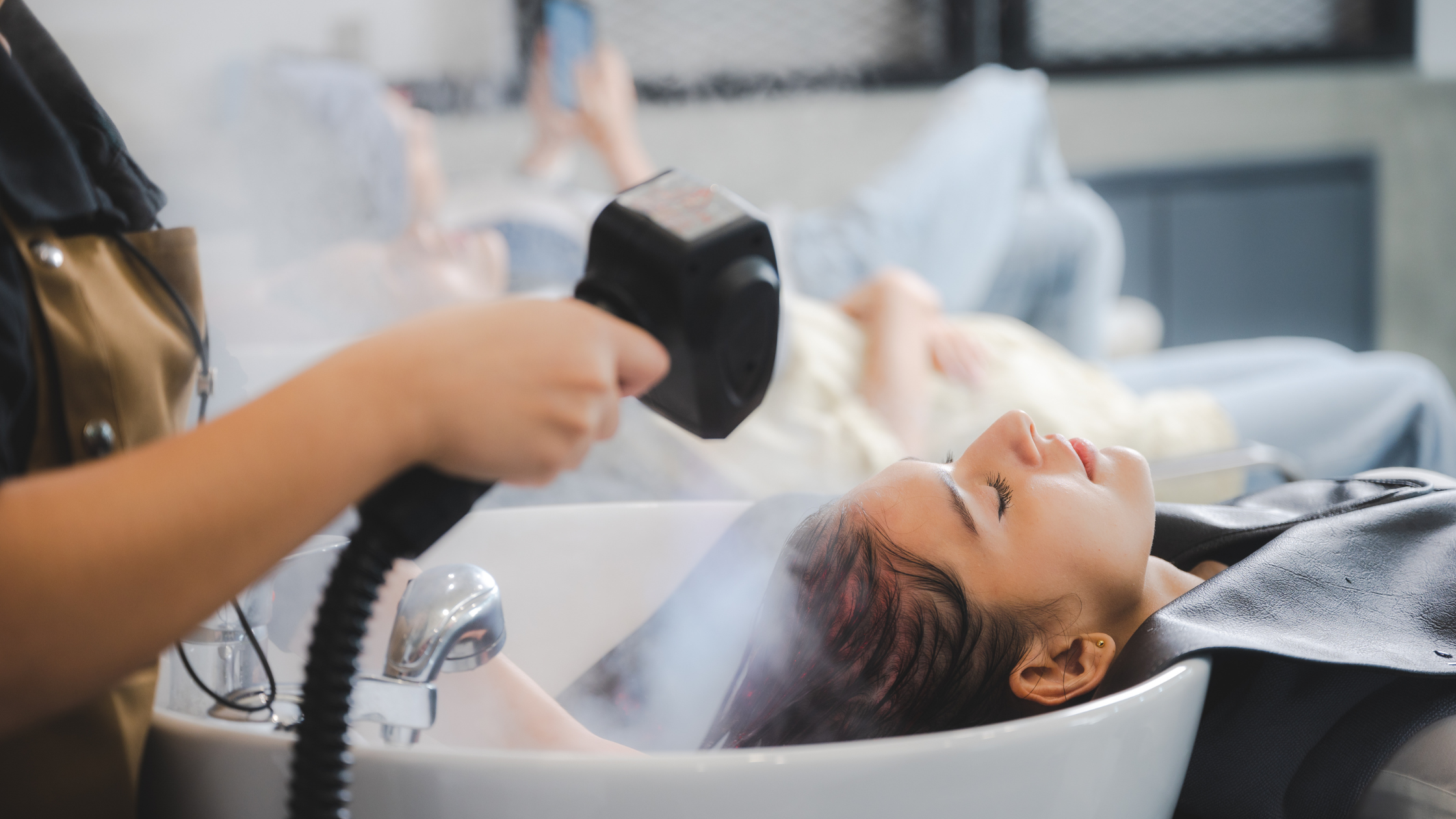 Warm steam applied during a head spa treatment to help scalp care products absorb